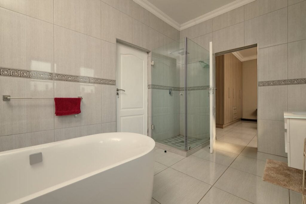 pexels-photo-20763296 A bathroom with a large tub and shower